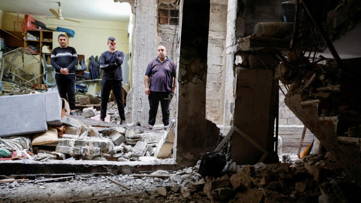 Palestinians check a house damaged during an Israeli raid, in Balata camp, Nablus, in the Israeli-occupied West Bank, May 22, 2023.