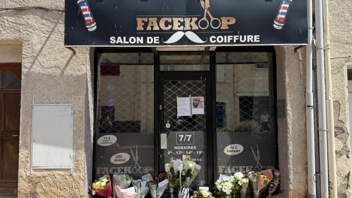 Bouquets of flowers lay outside the barber shop where the slain Tunisian man worked, in Puget-sur-Argens, in southern France.