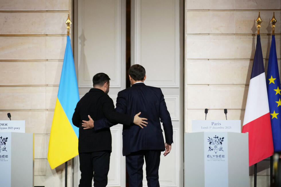 French President Emmanuel Macron and Ukrainian President Volodymyr Zelensky leave after holding a joint press conference at Élysée Palace in Paris, France.