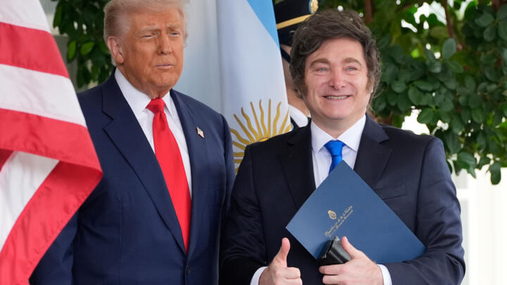 President Donald Trump greets Argentina's President Javier Milei at the White House, Tuesday, Oct. 14, 2025, in Washington.