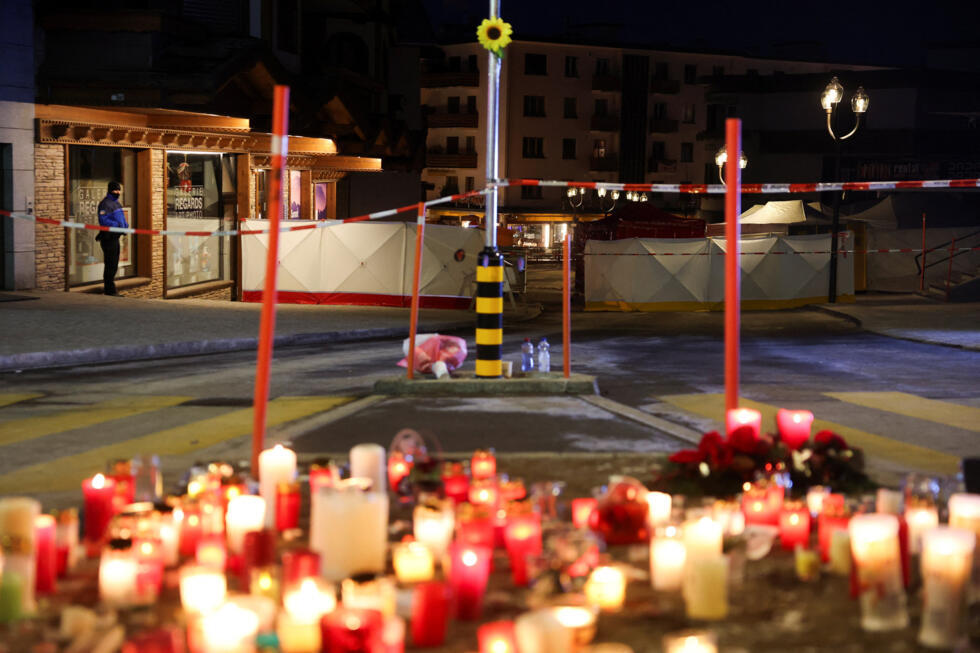 Candles are left at a memorial for victims outside the "Le Constellation" bar.