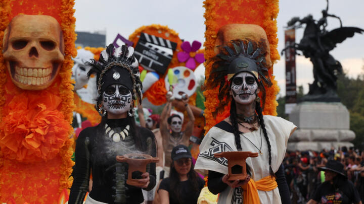 Revellers participate in the annual Day of the Dead parade in Mexico City on November 1, 2025.