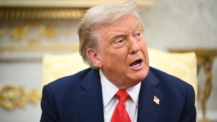 US President Donald Trump sits in the Oval Office at the White House in Washington, DC, on August 18, 2025.