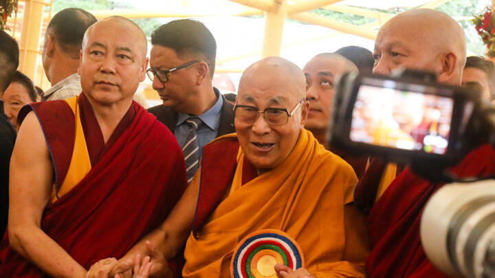 Tibetan spiritual leader the Dalai Lama (C) arrives to attend a Long Life Prayer offering ceremony at the Main Tibetan Temple in McLeod Ganj, near Dharamsala on June 30, 2025.