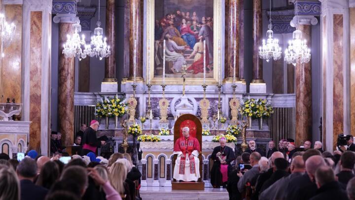 Pope Leo XIV listens as Archbishop Martin Kmetec of Izmir delivers his speech during a meeting with the clergy at the Cathedral of the Holy Spirit, in Istanbul, Turkey, November 28, 2025.