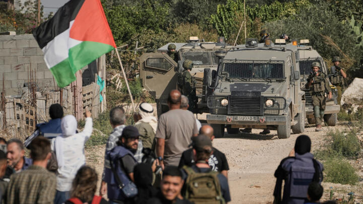 Israeli soldiers disperse protesters in the Nur Shams refugee camp in the West Bank city of Tulkarem on November 23, 2025.