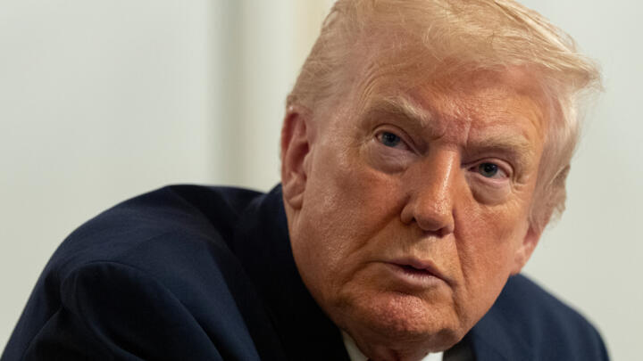 President Donald Trump speaks to reporters after speaking to troops via video from his Mar-a-Lago estate on Thanksgiving, Thursday, Nov. 27, 2025, in Palm Beach, Fla.