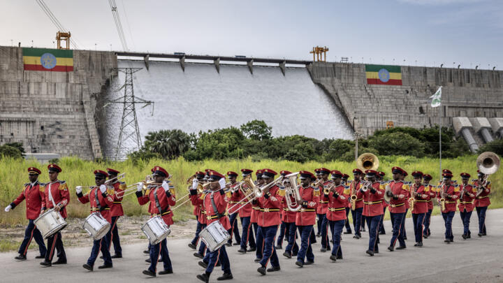 Members of the Ethiopian Republic March Band perform in front of the Grand Ethiopian Renaissance Dam (GERD) ahead of its official inauguration ceremony in Guba, on September 9, 2025. 
