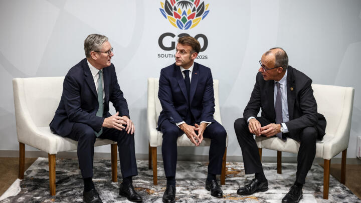 Britain's Prime Minister Keir Starmer, France's President Emmanuel Macron and German Chancellor Friedrich Merz attend a trilateral meeting at the G20 Leaders' Summit in Johannesburg, South Africa on
