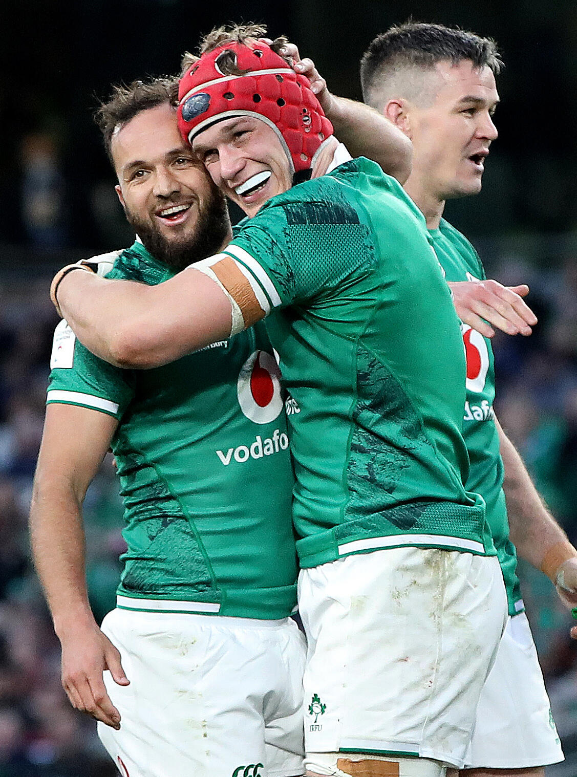 Congratulations to Irish Josh van der Flyer (C) and Jamieson Gibson Park after their first goal against Scotland on 19 March 2022 in Dublin.