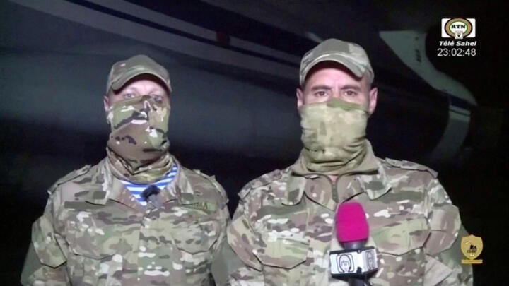 An image from video shown on Niger's state TV reportedly showed Russian military trainers speakintg to the media next to an airplane, in Niamey, Niger, April 10, 2024,