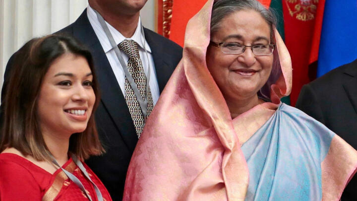 Tulip Siddiq (left) stands beside Bangladesh's then-Prime Minister Sheikh Hasina in this file photo from January 2013.