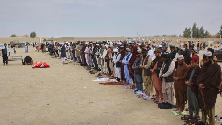 Afghans pray during the funeral of a man killed during an overnight exchange of fire between Afghan and Pakistani forces along the border in Spin Boldak, Kandahar province, Afghanistan on December 6, 2025.