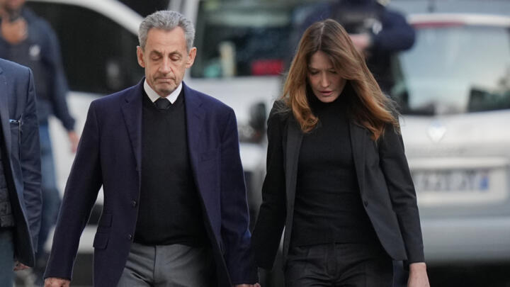File photo of Nicolas Sarkozy and his wife Carla Bruni-Sarkozy leaving their home as the former French president heads to prison, Paris, October 21, 2025.