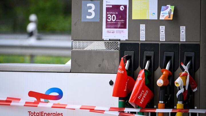 Signs that read "out of service" in French are seen on the nozzles at a TotalEnergis petrol station in Rouffach, eastern France, on October 8, 2022.