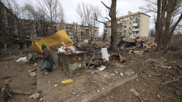 A local woman walks in the yard of a residential neighbourhood after a Russian attack in Kostiantynivka, Ukraine, Saturday, Jan. 28, 2023.