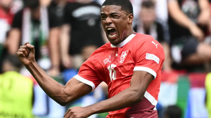 Switzerland's forward #18 Kwadwo Duah celebrates scoring the opening goal during the Euro 2024 Group A football match between Hungary and Switzerland at the Cologne Stadium in Cologne on June 15, 2024