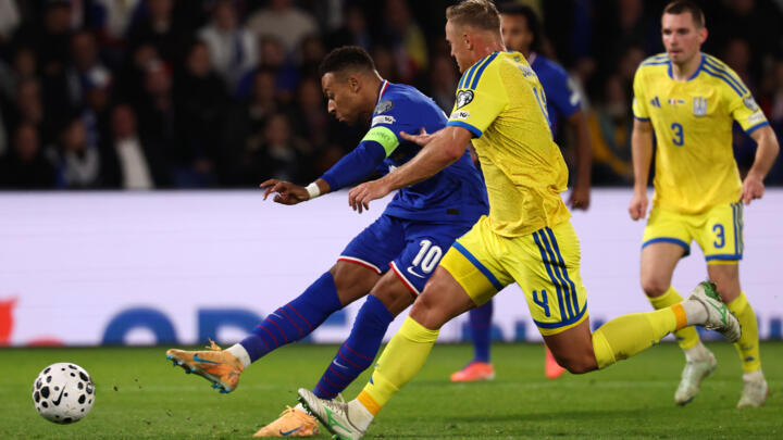 Second-half goals by Kylian Mbappe (L) and Michael Olise, as well as a first international strike for Hugo Ekitike, booked France's place at the 2026 World Cup