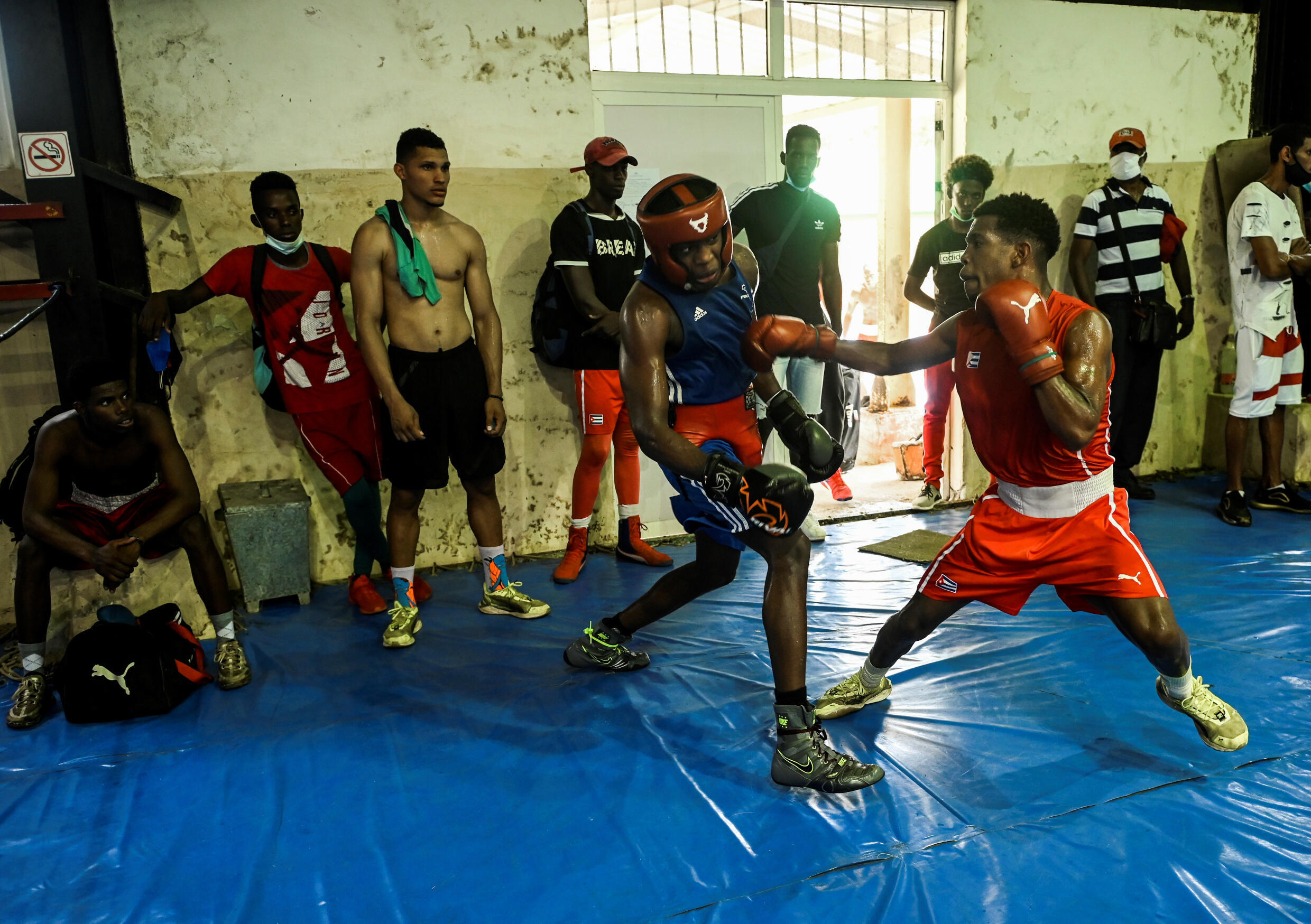 Members of the Olympic teams from Cuba, France and Spain take part in an empty session at the National Boxing School, in Havana, on April 7, 2022.