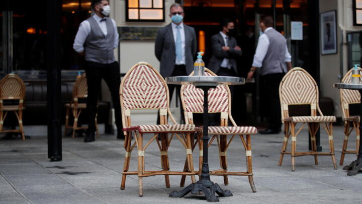 Tables are set on a terrace of a cafe during preparations for the reopening of restaurants and bars in Paris as part of an easing of the country's lockdown restrictions amid the coronavirus disease (COVID-19) outbreak in France, May 18, 2021.