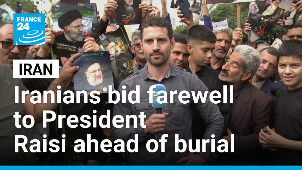 Tens of thousands in Iran march to mourn Raisi ahead of burial