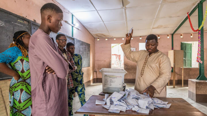 Members of Benin’s National Electoral Commission (CENA) supervise vote counting in in Cotonou.