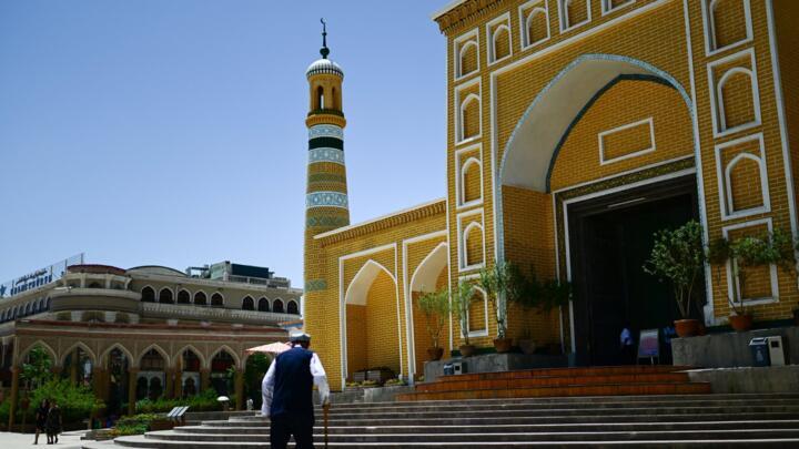 This picture taken on July 14, 2023, shows a Uyghur man outside the Id Kah Mosque in Kashgar city in northwestern China's Xinjiang region.