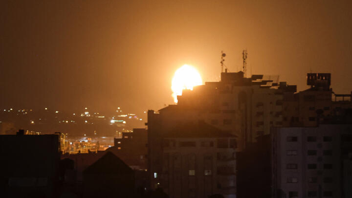 Smoke and flames rise above buildings after Israeli air airstrikes in Gaza City, on July 5, 2023.