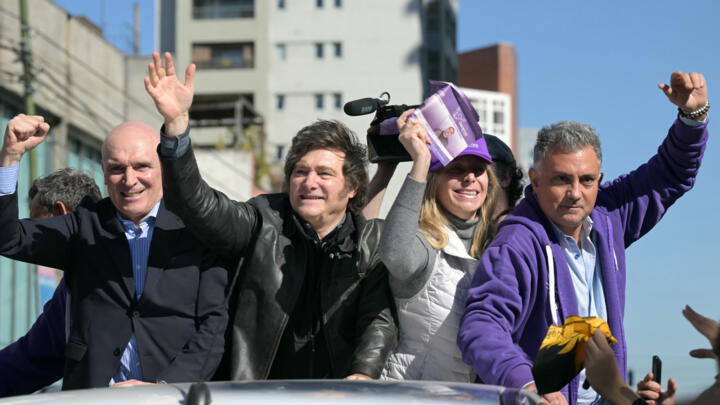 Argentine President Javier Milei (2nd left) shortly before being targeted by projectiles, in Lomas de Zamora, Argentina, on August 27, 2025.