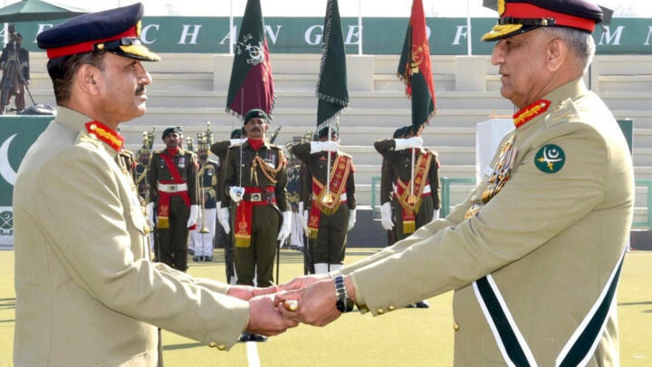 Pakistan's outgoing army chief General Qamar Bajwa hands over the baton of command to General Asim Munir (L) in Rawalpindi, Pakistan, November 29, 2022.