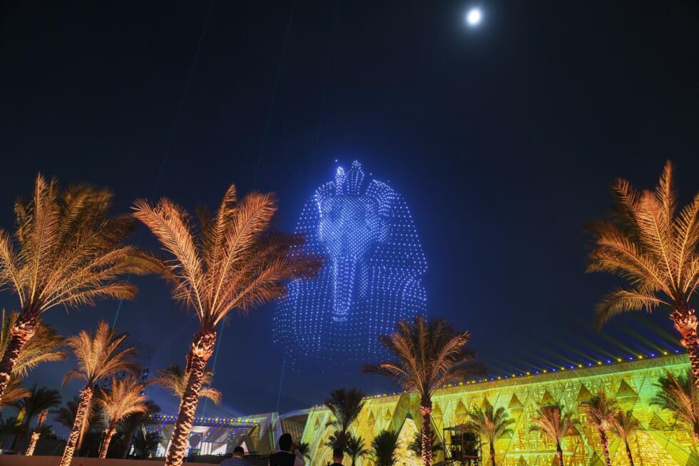 A drone display depicting King Tut's mask lights up the sky above the Grand Egyptian Museum during its official opening in Giza, Egypt, on November 1, 2025.