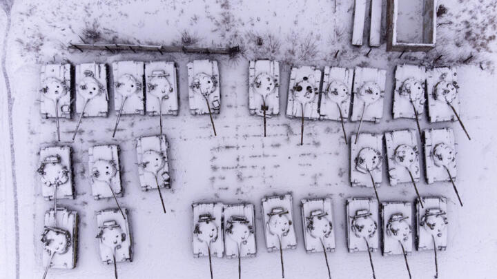 Old T-64 tanks covered by snow stands at the depot site at the Tank Repair Plant in Kharkiv, Ukraine on January 31, 2022.