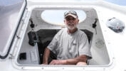 Jean-Jacques Savin pictured on his rowboat last year at a shipyard in Lege-Cap-Ferret, southwestern France.