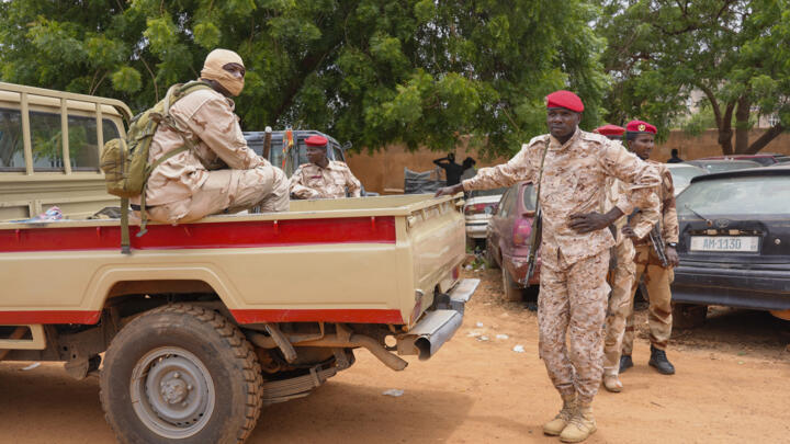 Nigerien national guardsmen sit outside the customs offices in Niamey, Niger, Monday, August 21, 2023.