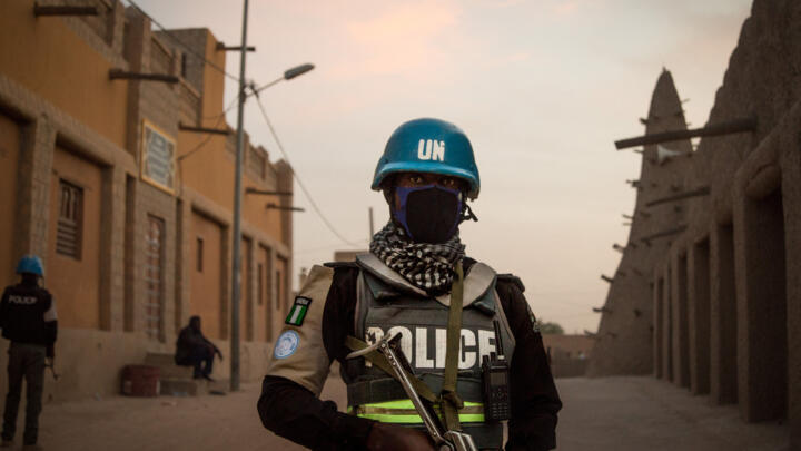 In this photo taken on December 8, 2021, an officer in the United Nations Multidimensional Integrated Stabilization Mission in Mali (MINUSMA) patrols in front of the Great Mosque in Timbuktu.