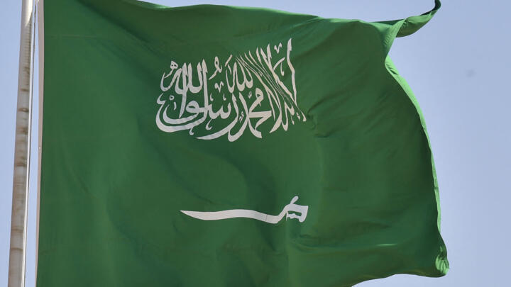 A picture taken on September 22, 2020 shows a Saudi national flag in Riyadh. 