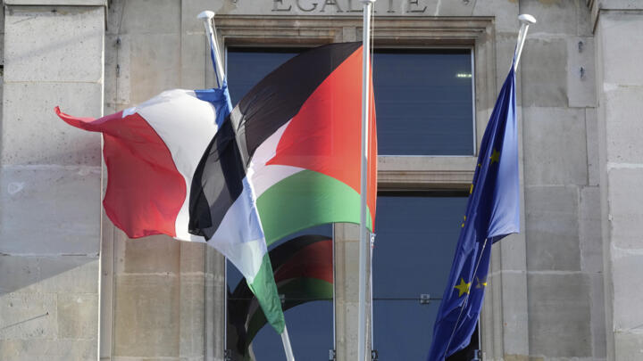 The Palestinian flag, center, flies on the facade of the Saint-Denis city hall on Monday, September 22, 2025, in Saint-Denis, outside Paris.