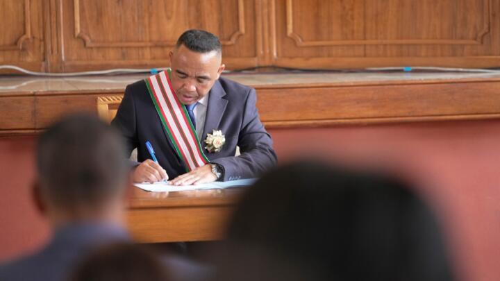 Col. Michael Randrianirina signs documents after being sworn in as president in Antananarivo, Madagascar, October 17, 2025.