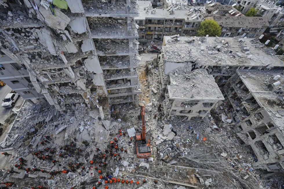 Israeli soldiers search through the rubble of residential buildings destroyed by an Iranian missile strike in Bat Yam, central Israel.