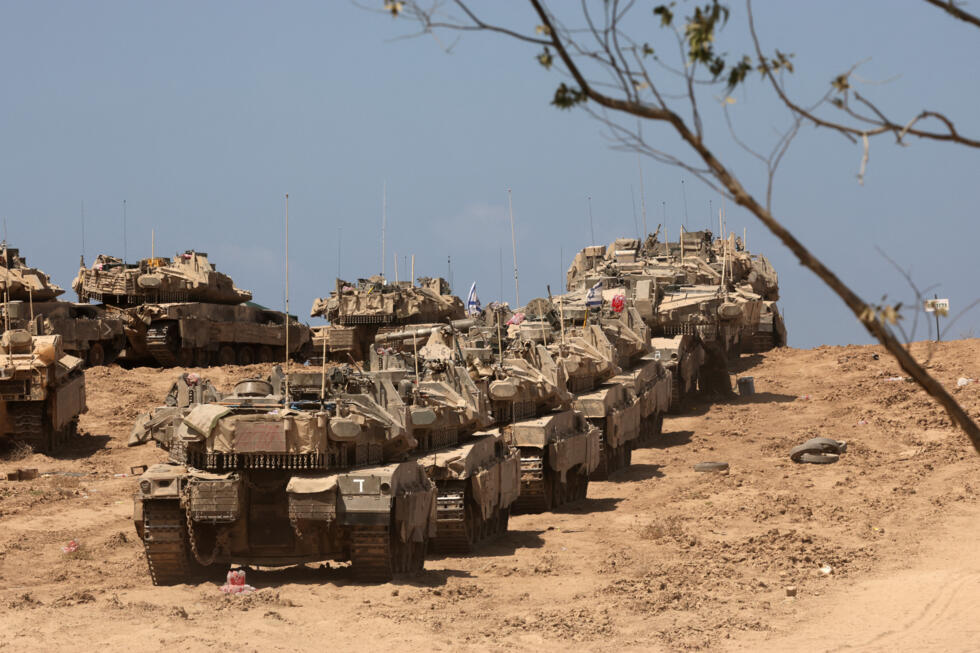 A photo taken from near Israel's border with the Gaza Strip shows Israeli troops deploying near the border fence on September 17, 2025. Israel launched a ground assault on Gaza City before dawn on Sep