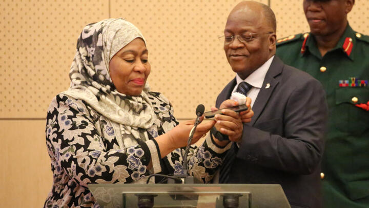 Tanzania's new President Samia Hassan Suluhu and former president John Magufuli on July 24, 2019. 