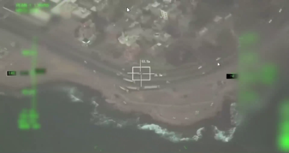 In the video released by the coalition, vehicles can be seen at the 0:55 mark driving along a coastal road located outside the port of Mukalla.