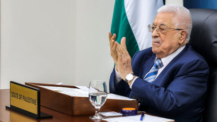 This handout picture provided by the Palestinian Authority's press office (PPO) shows Palestinian president Mahmud Abbas applauding as he gives by video link an address to the UN summit .