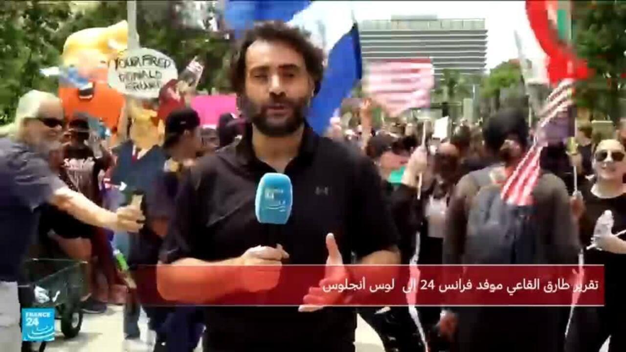 متظاهرون يحتجون خلال حفل مشاة البحرية الأمريكية