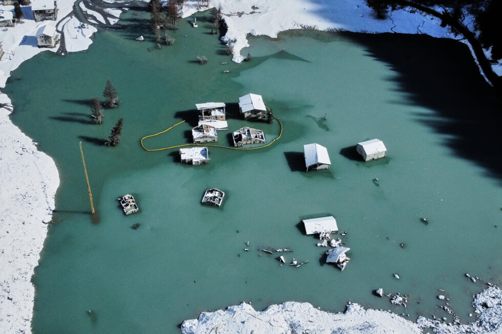 An aerial view shows the partly flooded village of Blatten in Switzerland after recent snowfalls, five months after a landslide destroyed the village.