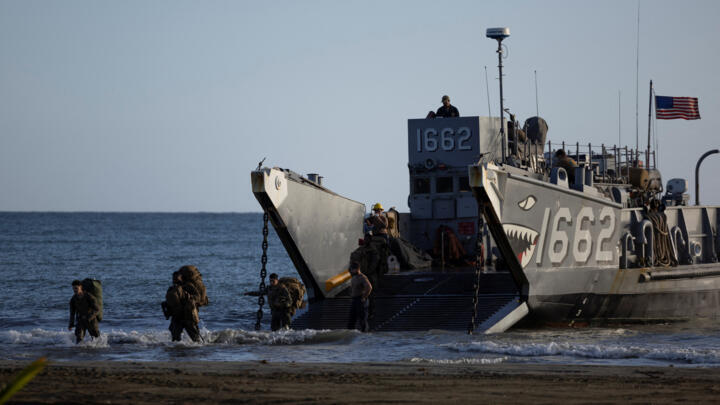 US Marines disembark from a landing vessel during amphibious operations in Arroyo, Puerto Rico, on December 9, 2025, amid a US military buildup in the Caribbean.