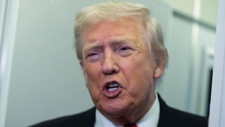 President Donald Trump speaks to reporters on board Air Force One on his way back to the White House from his Mar-a-Lago estate in Florida on November 2, 2025.