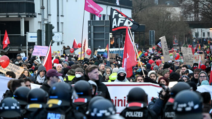 Protesters confront police during a demonstration against Germany's far-right AfD party, which was holding a conference in Giessen, Germany, on 29 Nov. 2025.
