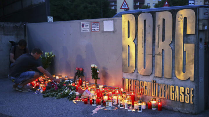 Candles placed at the entrance to the school in Graz where a gunman killed 10 people before taking his own life on June 10, 2025.