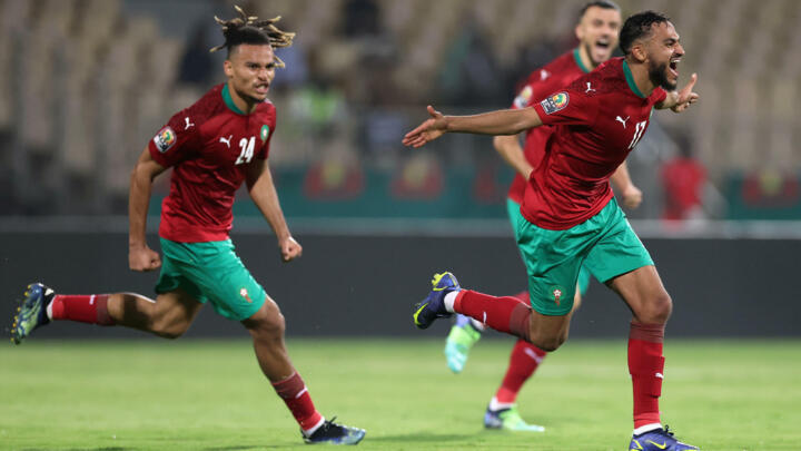 Morocco midfielder Sofiane Boufal, at right, celebrates scoring the only goal of an Africa Cup of Nations Group C match against Ghana, January 14, 2022.